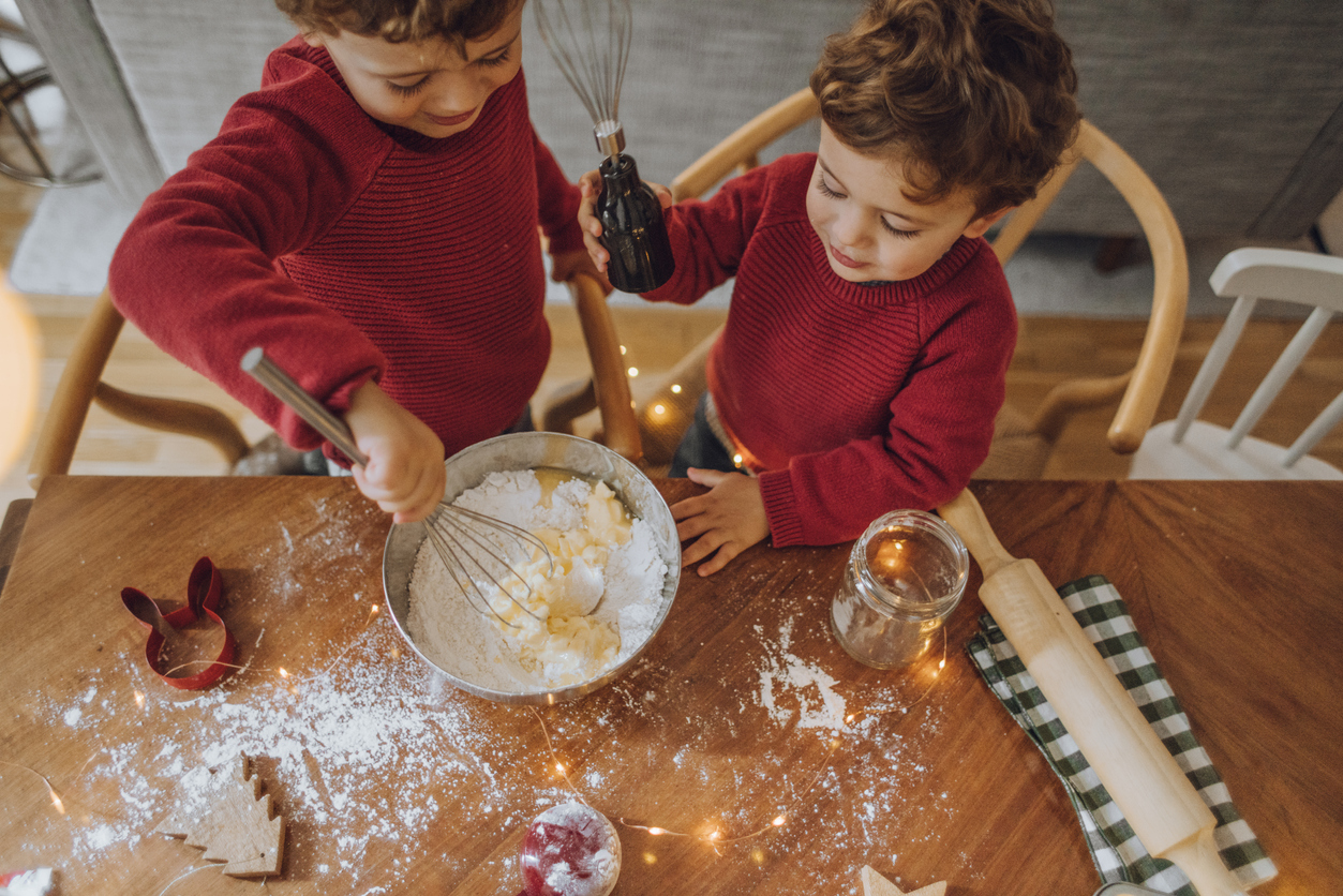 Boys cooking christmas cookies