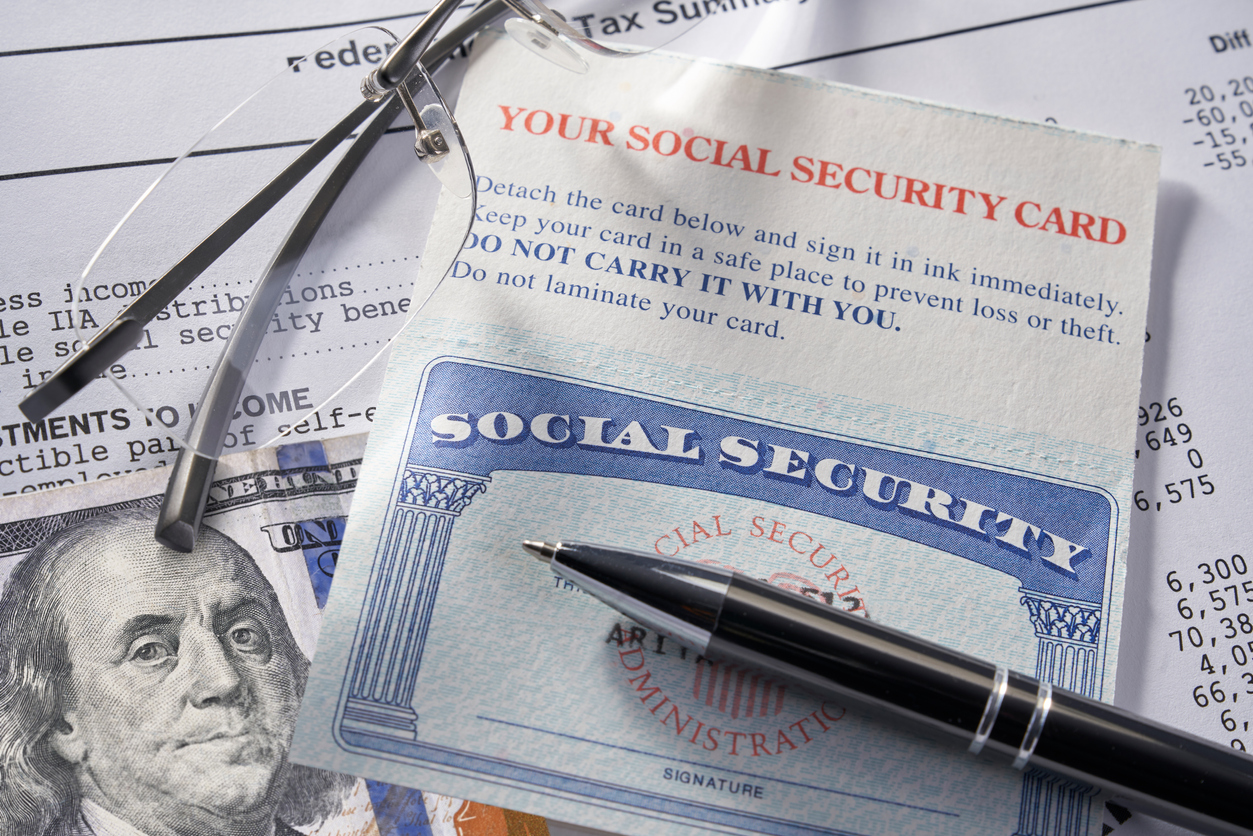 Social Security Card with money pen and glasses: $100 dollars