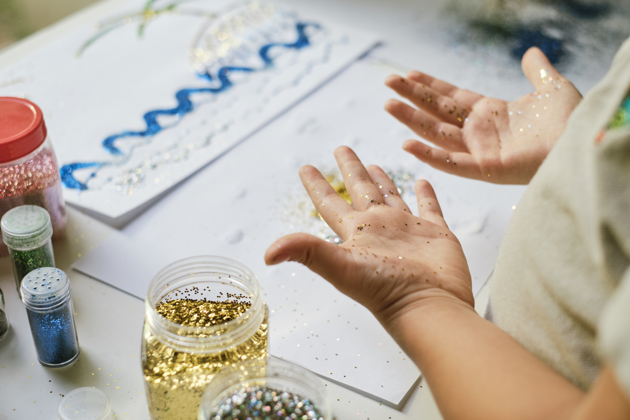 Child holding his hands with sparkle palms up