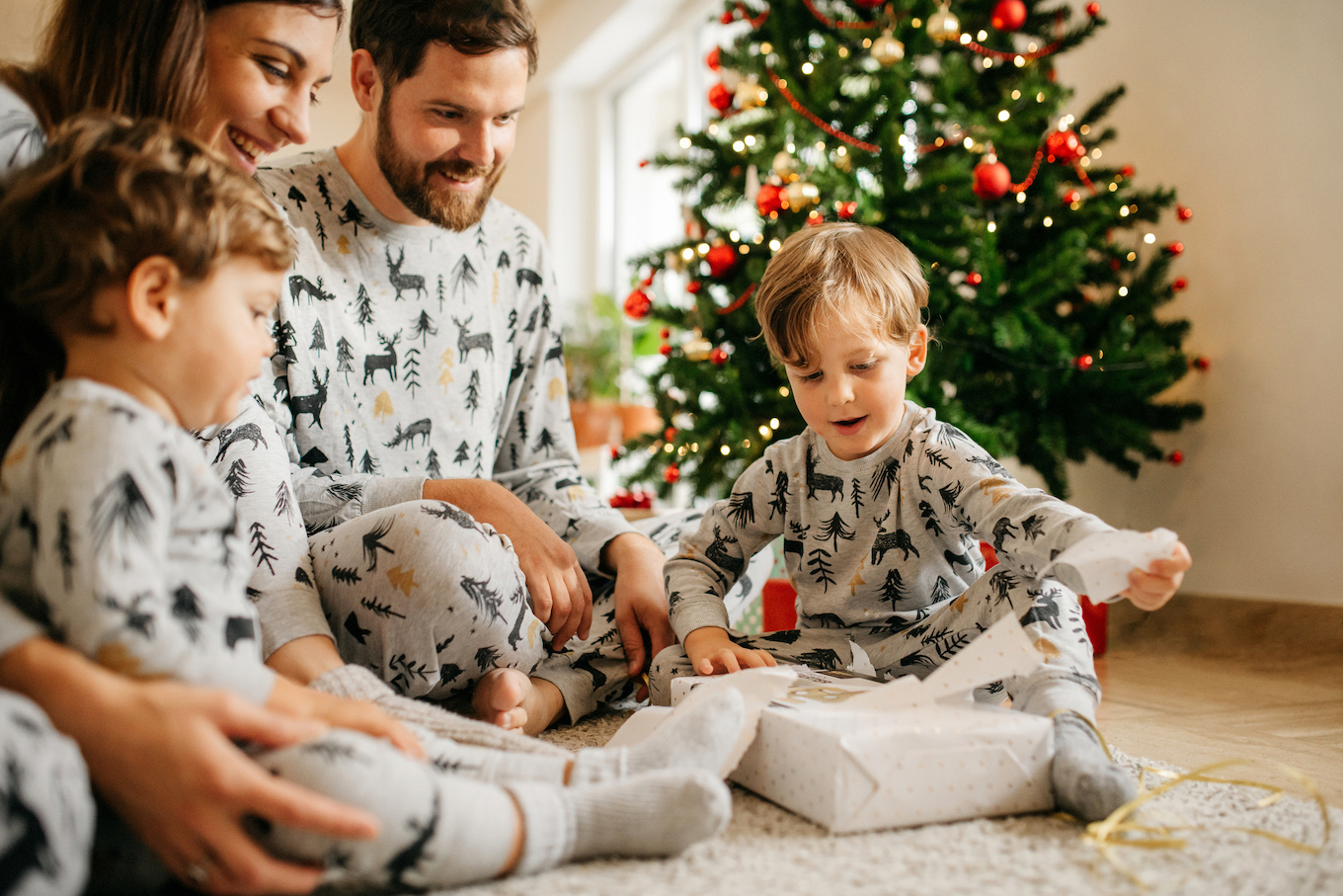 Family opening christmas presents