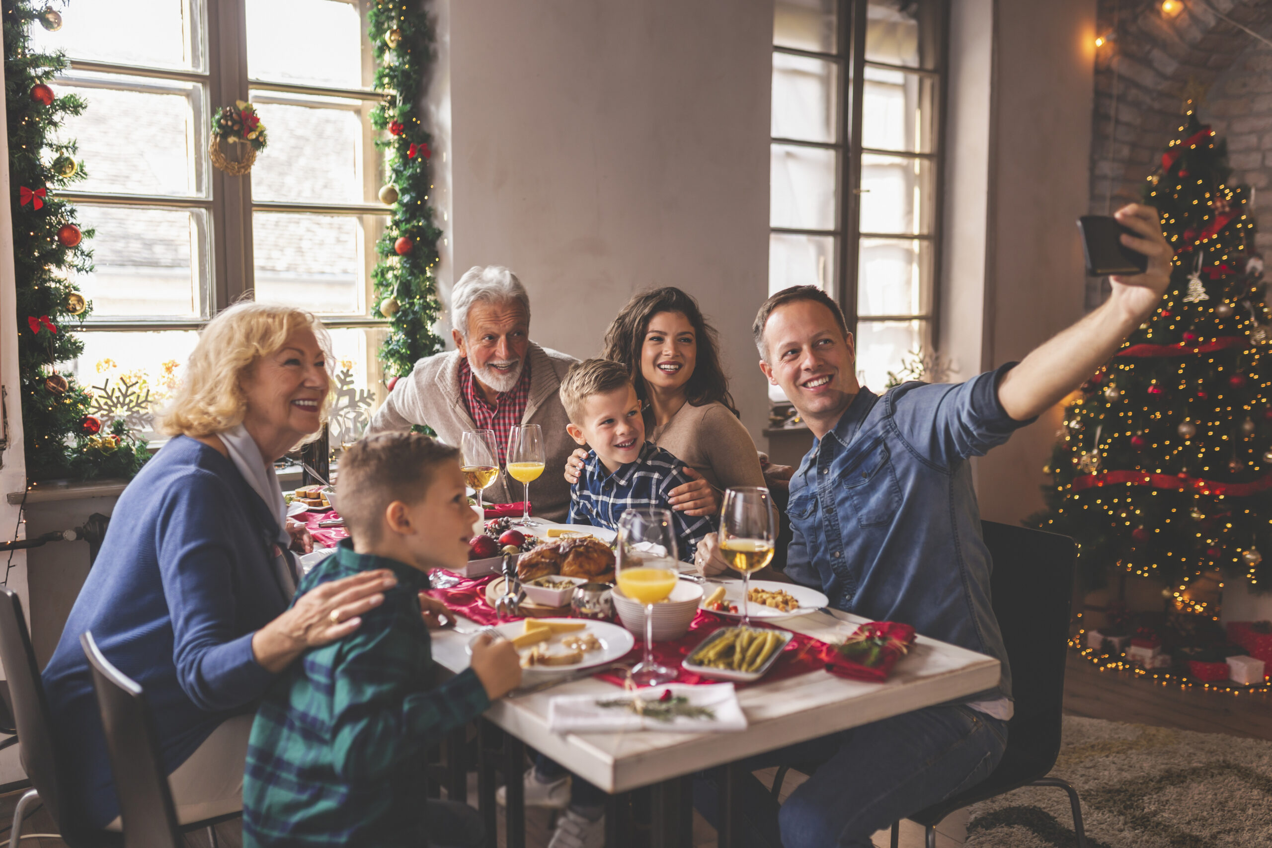 Family taking a selfie during Christmas dinner