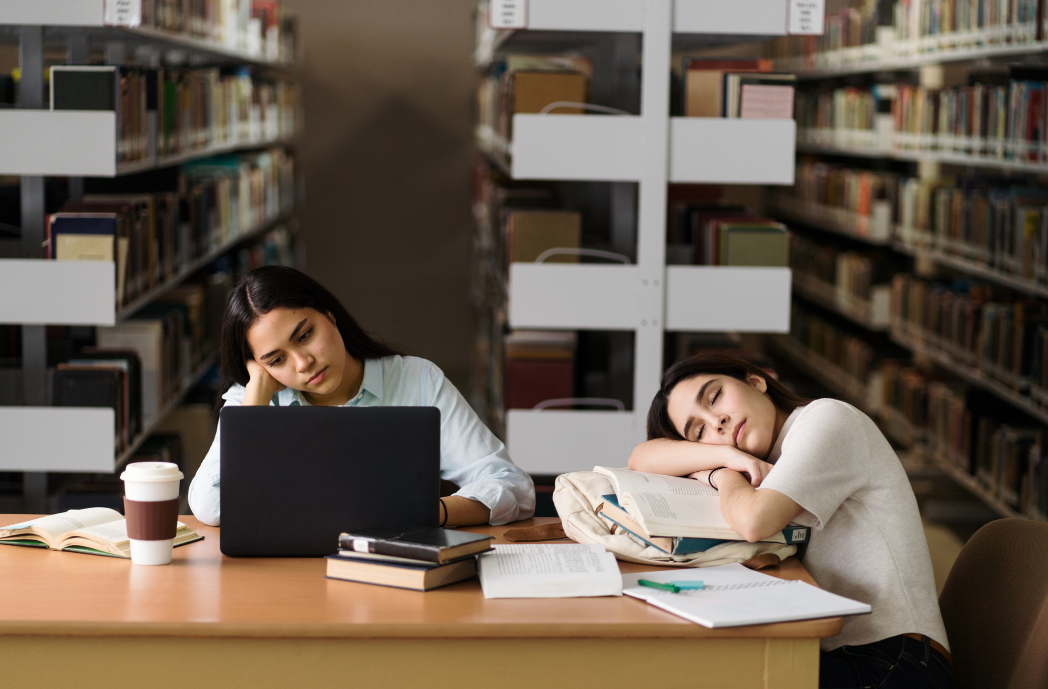 Female student being tired at library