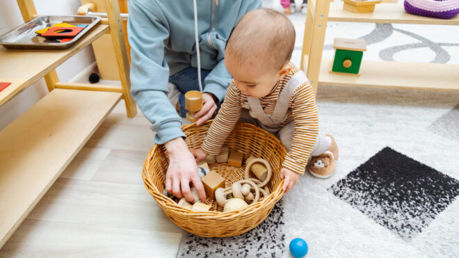 Child playing with a toy basket