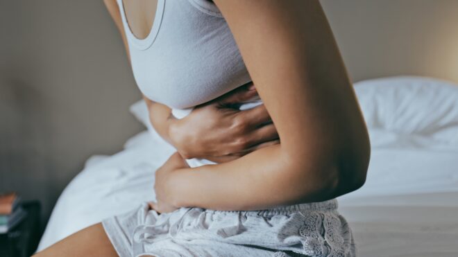 Woman holding stomach