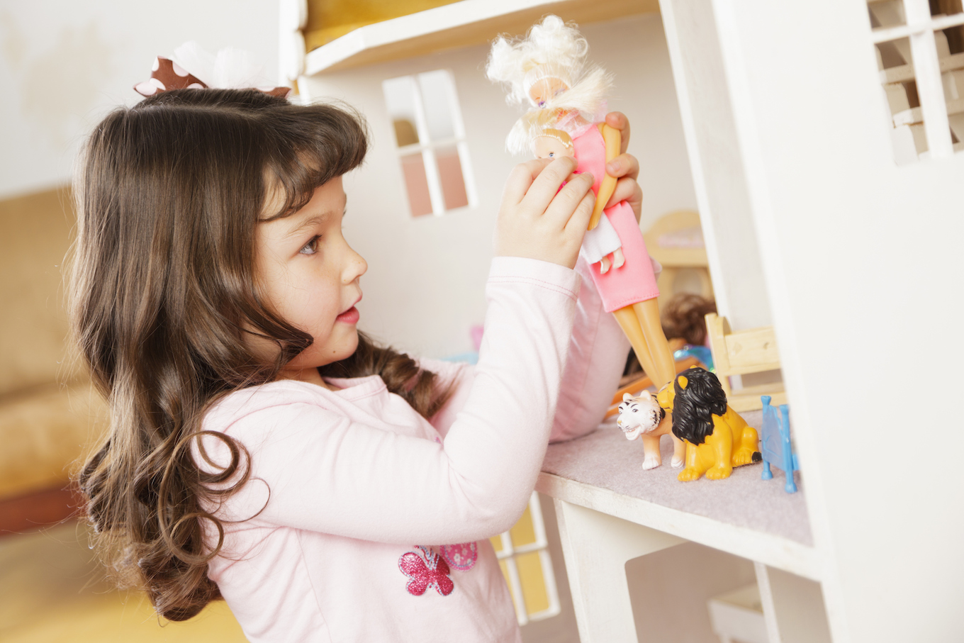 Little Girl with Dollhouse