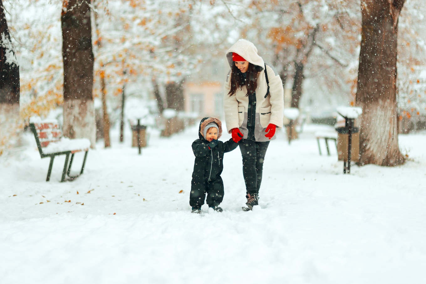 Mom and child walking in the snow