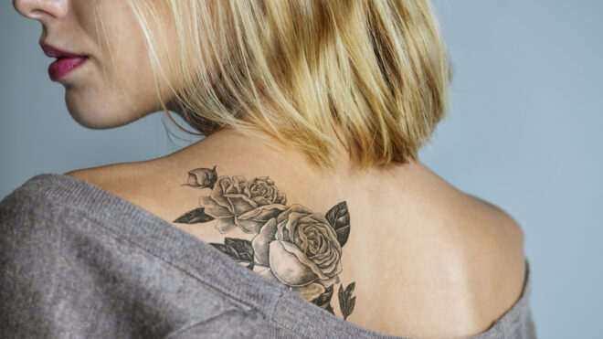 woman with flower tattoo