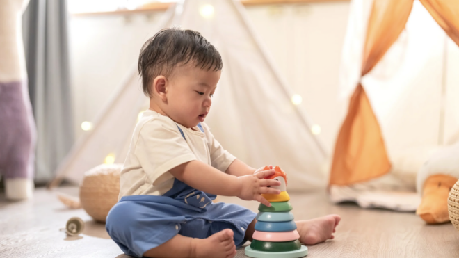 little boy playing with toys