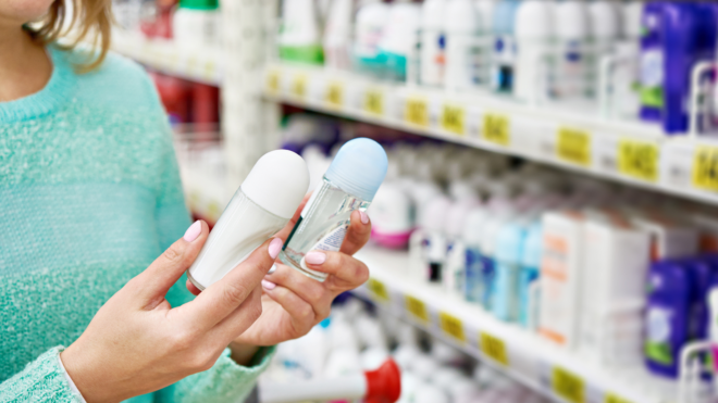 Woman holding deodorants